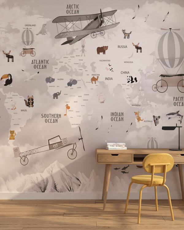 Дизайнерські фотошпалери карта світу у сірих відтінках з ілюстраціями гір, різних живтоних та літаків з кулями у дитячій кімнаті