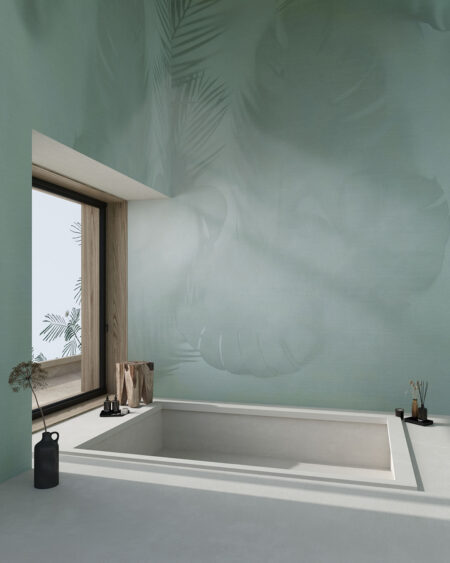 Фотообои листья Монстеры в стиле тени на светло-зеленом фоне в ванной